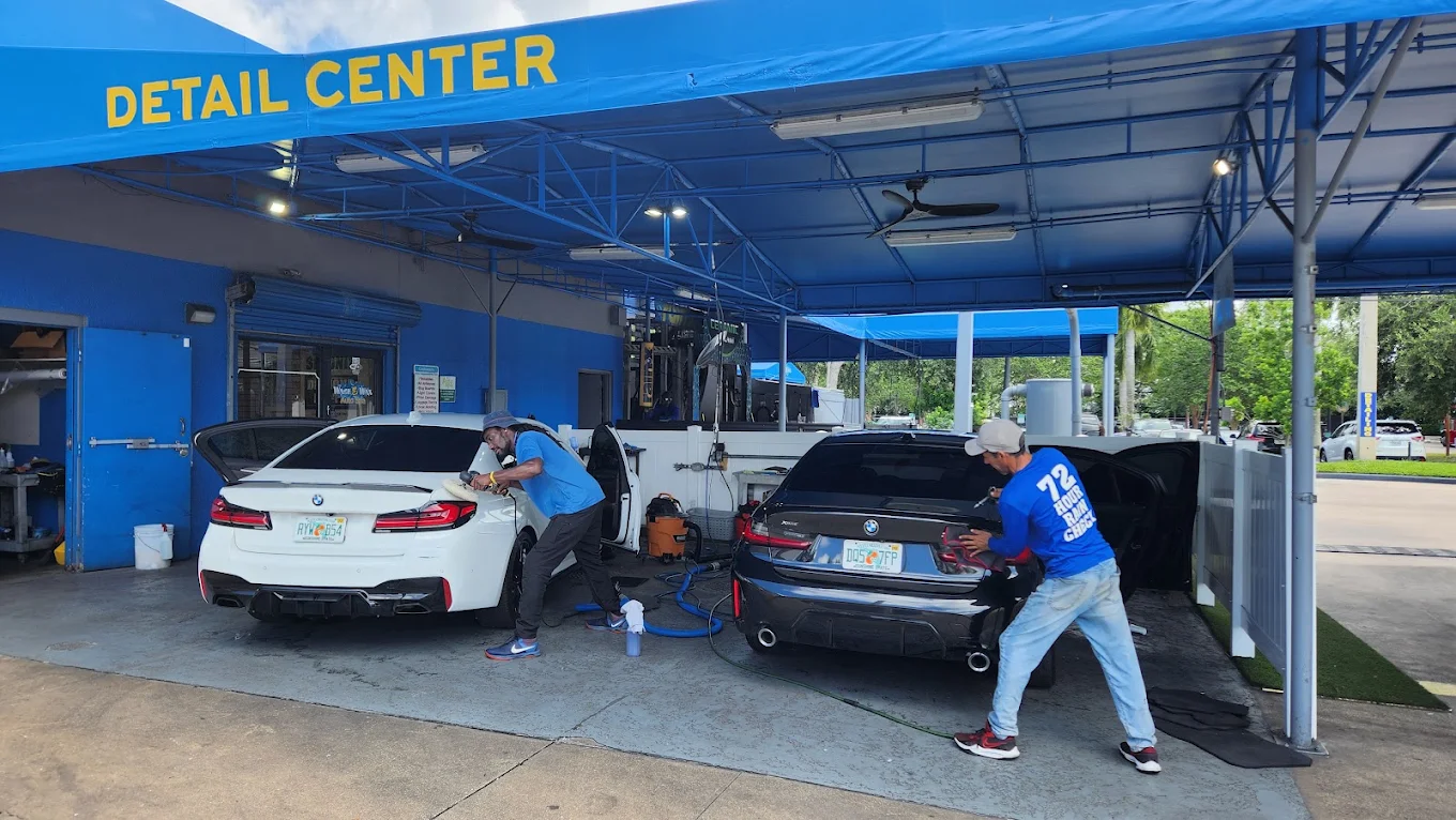 Cars being detailed at the Palm Beach Auto Spa detail center